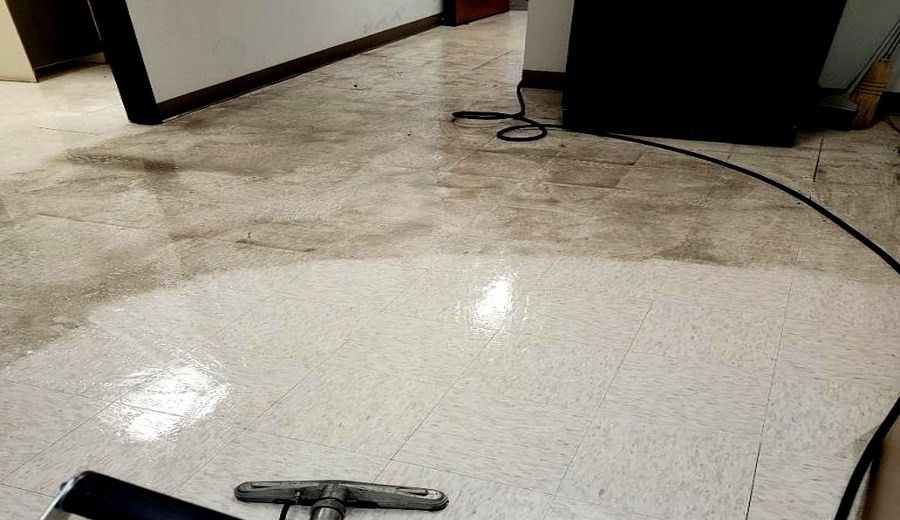 Tile cleaning showing dirty and clean contrast